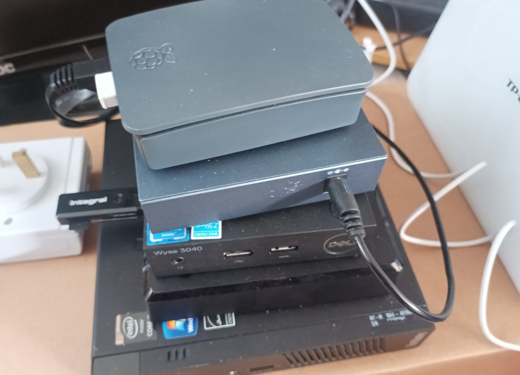 A stack of mini PCs (and a network switch which found its way into the pile).